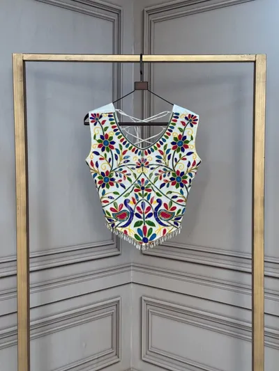 White color soft rayon blouse with heavy embroidery kutchi work